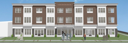 A large brown and white building with a group of people in front.