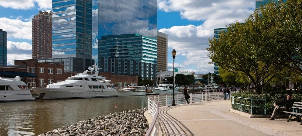 a boat is docked in the water in a city