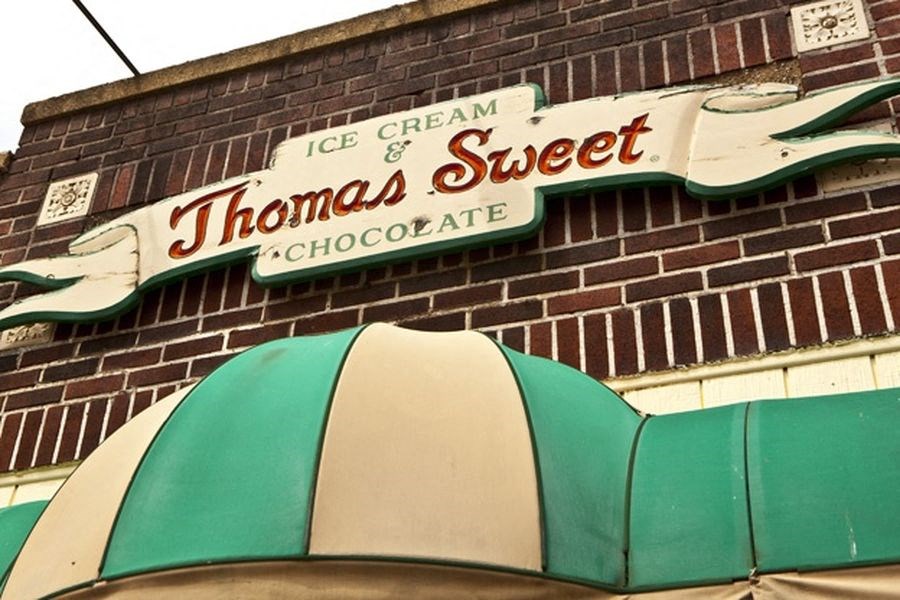 a sign on the side of a brick building