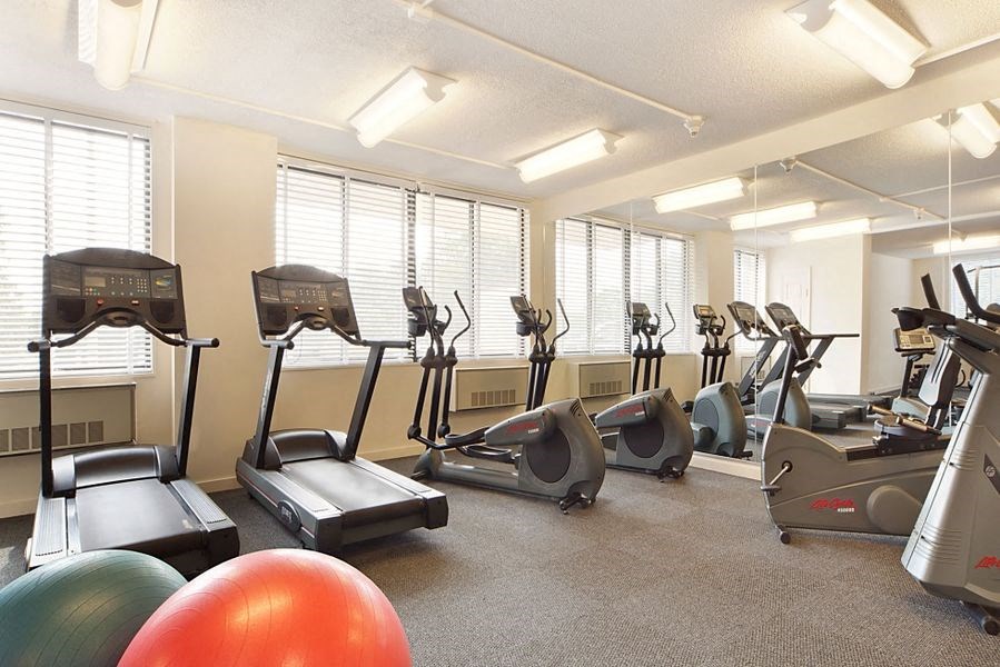 a gym with cardio machines and other exercise equipment