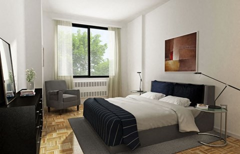 a bedroom with a bed and a chair and a window
