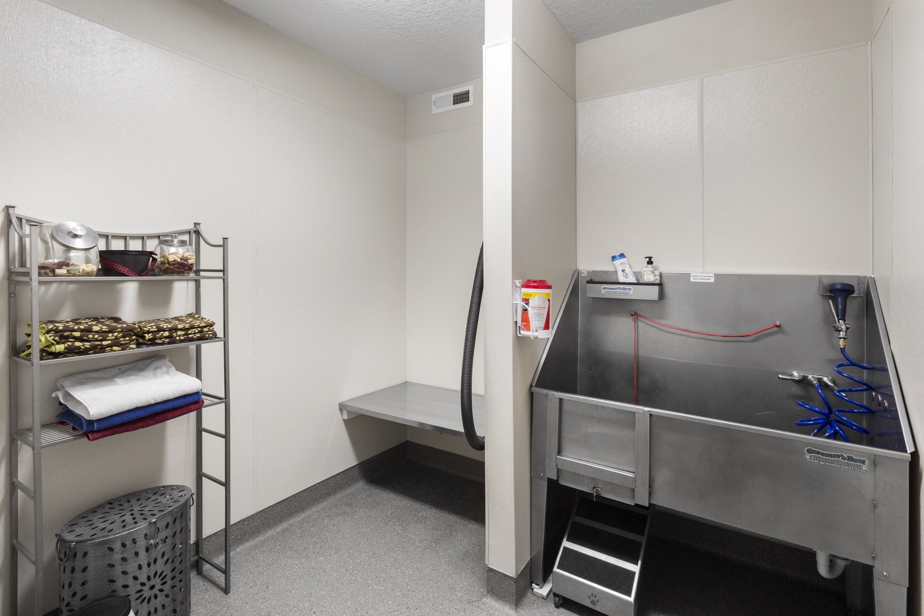 pet spa with vacuum, wash tub, and treats