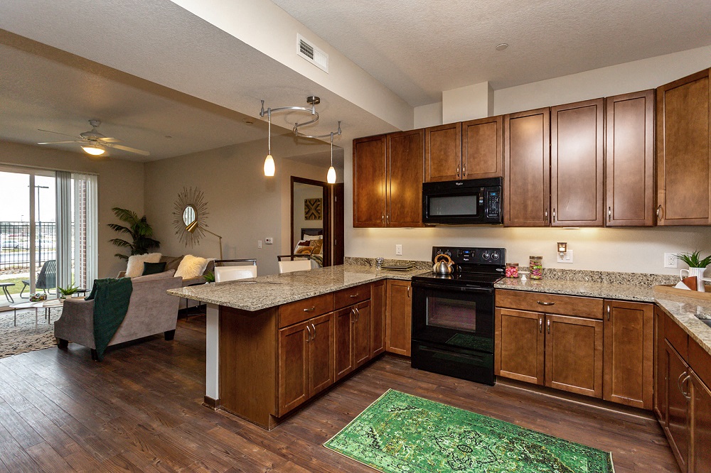 spacious kitchen with modern appliance and wide countertops