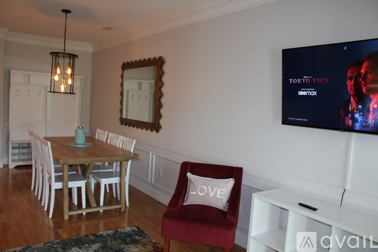 A living room with a TV showing the movie "Tokyo Vice".