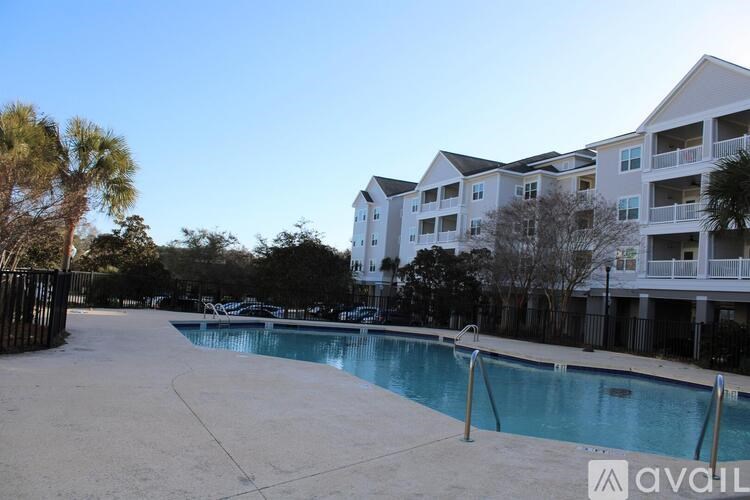 A swimming pool surrounded by apartment buildings.