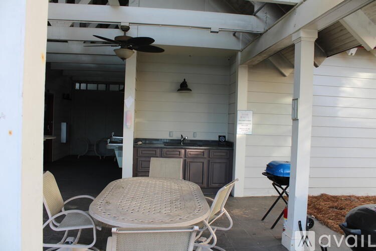 A patio with a table and chairs is shown.