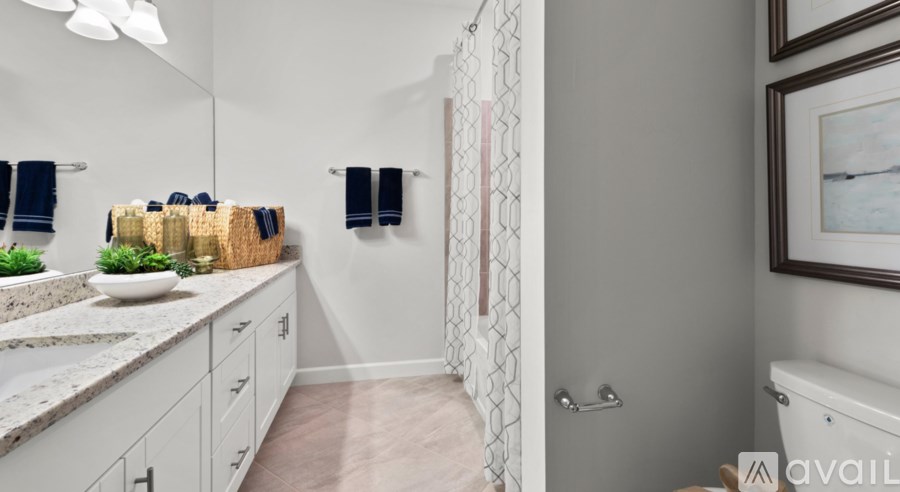 A bathroom with a sink, towel rack, and a bathtub.