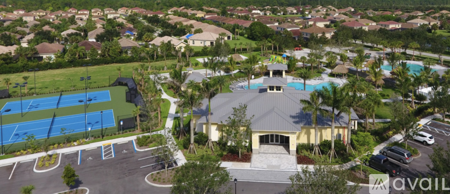 A large building with a pool in front of it.