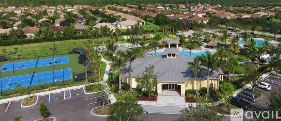 A large building with a pool in front of it.