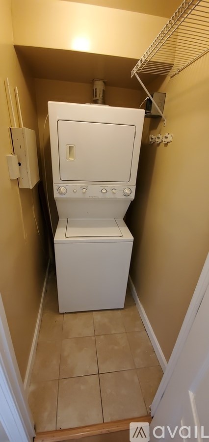 A white toilet in a small bathroom.