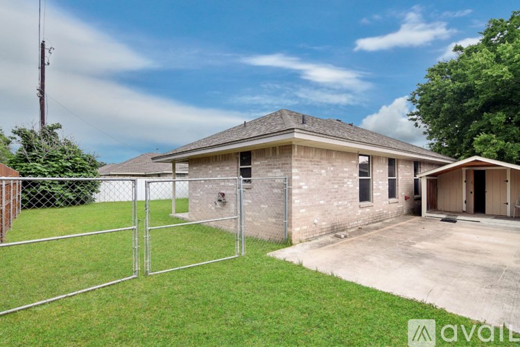 A house with a brown brick exterior and a grey roof is available for rent.