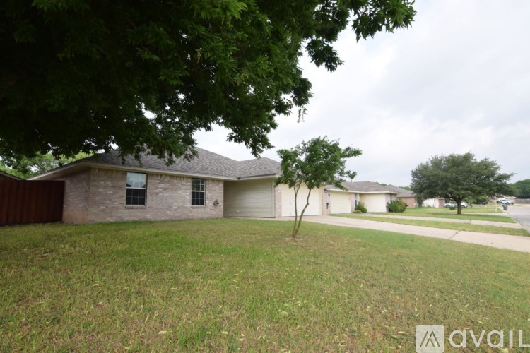 A house with a tree in front of it.