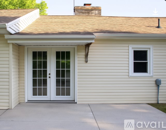 A house with a white door and a window.