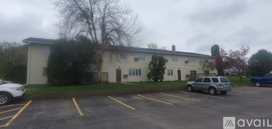 A parking lot with a building in the background.