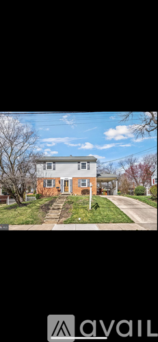 A house with a lawn in front of it.