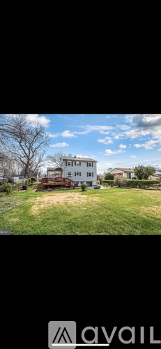 A house with a yard in front of it.