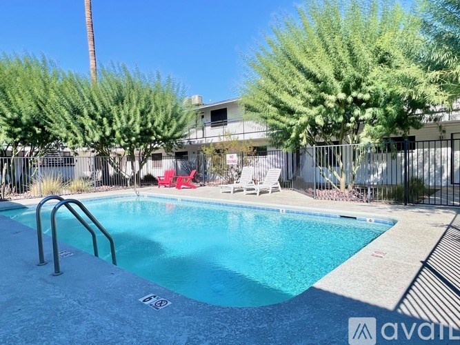 A pool surrounded by trees and a fence with a sign that says "available".