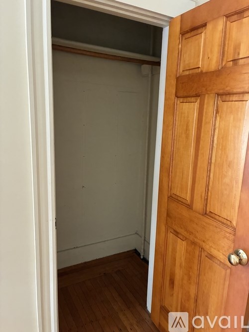 Two chairs are on a wooden deck.