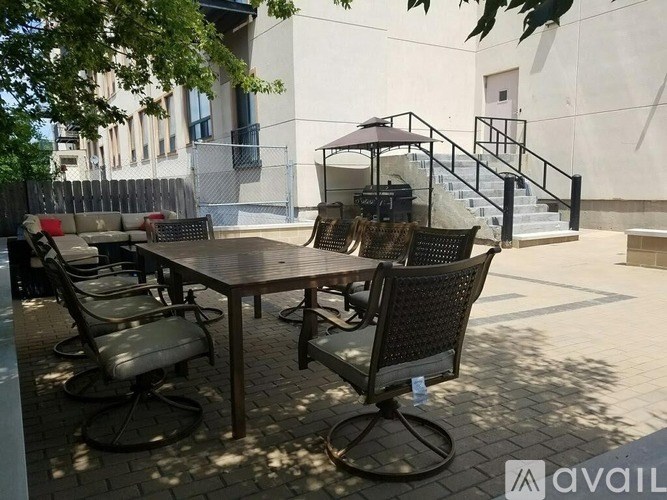 A patio with a table and chairs is available for rent.