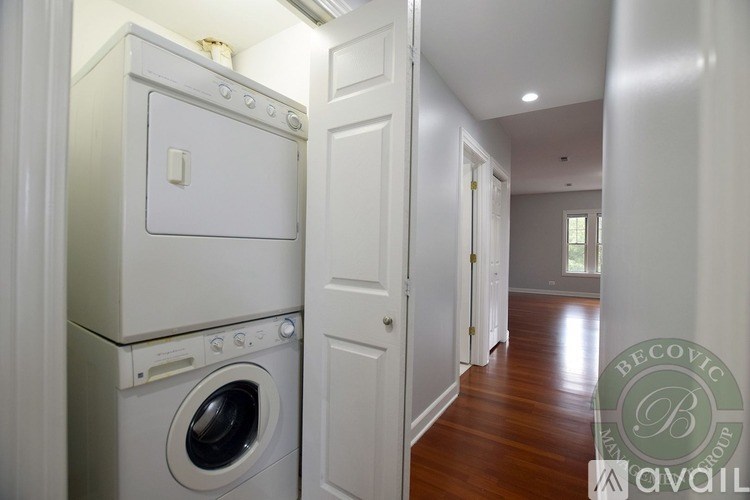 A white washer and dryer in a laundry room.
