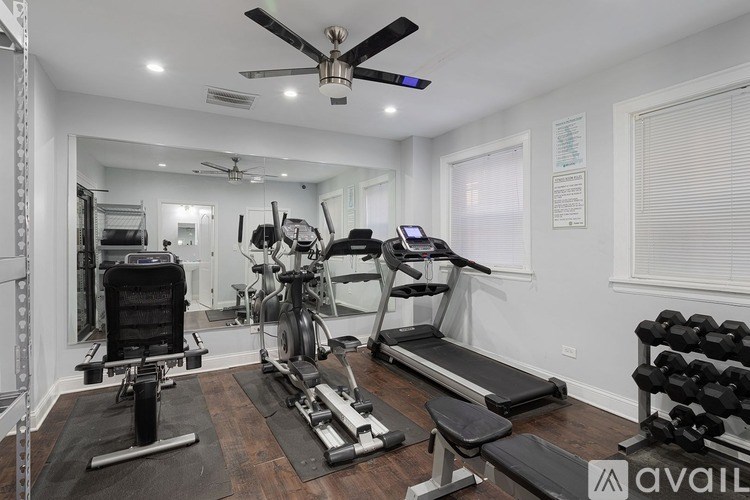A well-equipped home gym with a variety of exercise equipment.