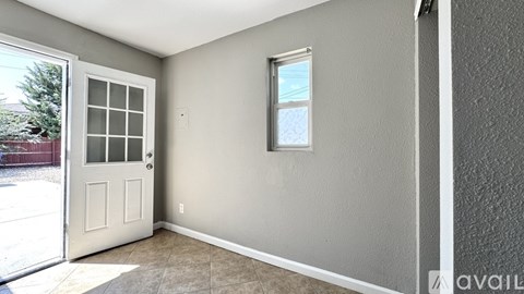 A room with a door and a window.
