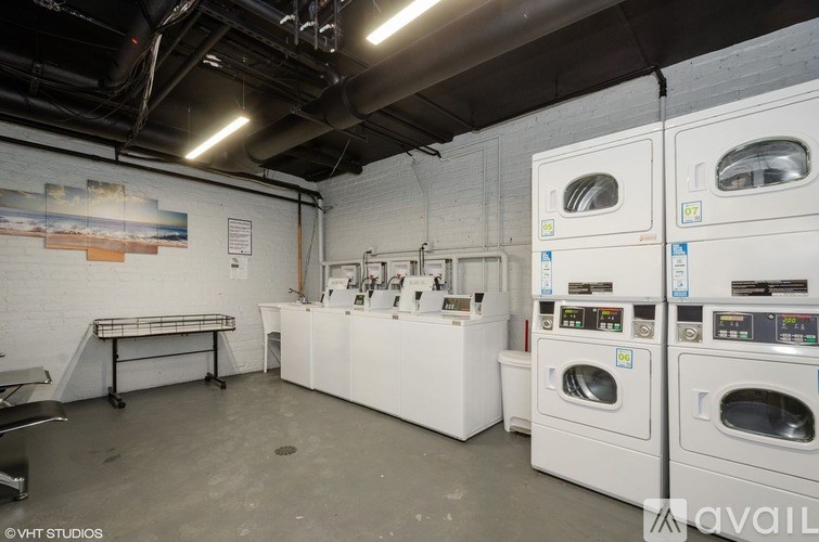 A laundry room with washers and dryers.