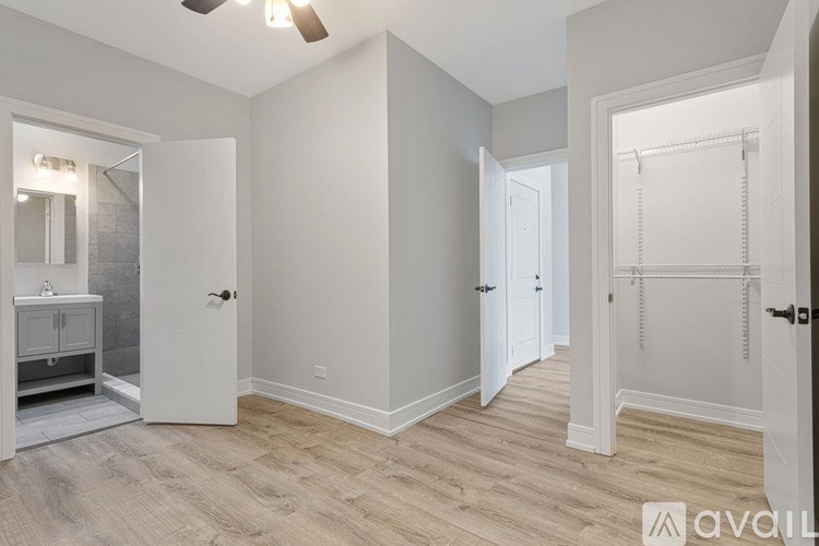 A spacious bathroom with a walk-in shower and double vanity.