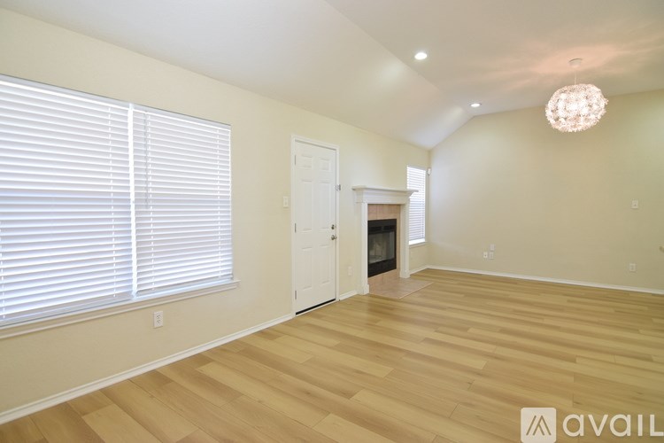 A kitchen with a dishwasher and a refrigerator.