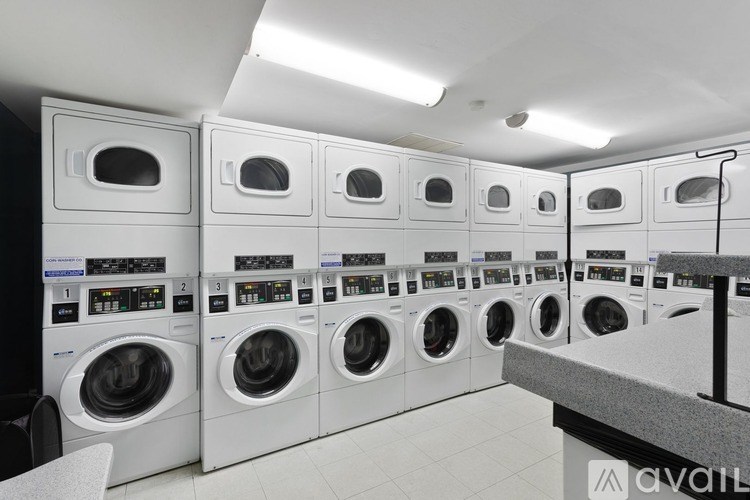 A row of washing machines in a laundromat.