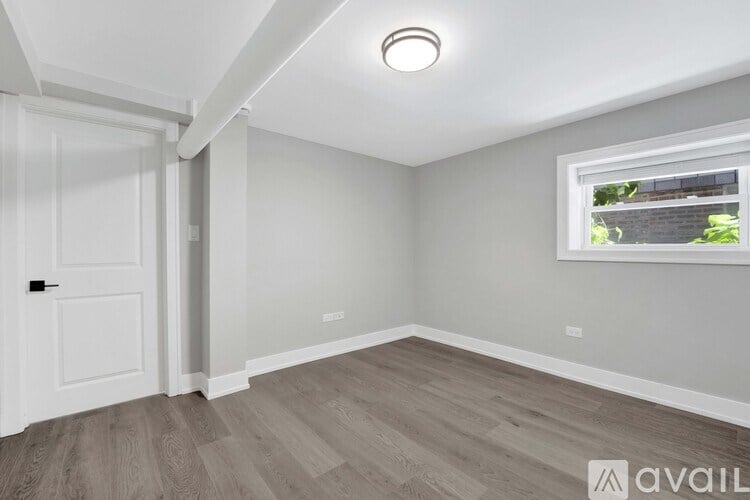 A room with a window and a door.