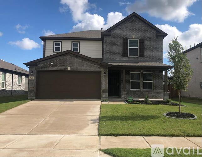 A two-story house with a garage is available for sale.
