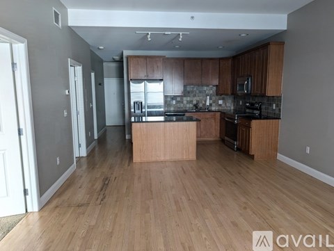 A kitchen with wooden floors and a countertop.