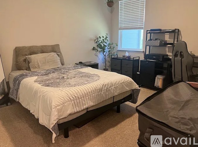 A white washing machine and dryer in a small laundry room.