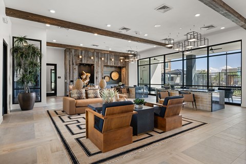 A modern living room with a large wooden coffee table and a fireplace.