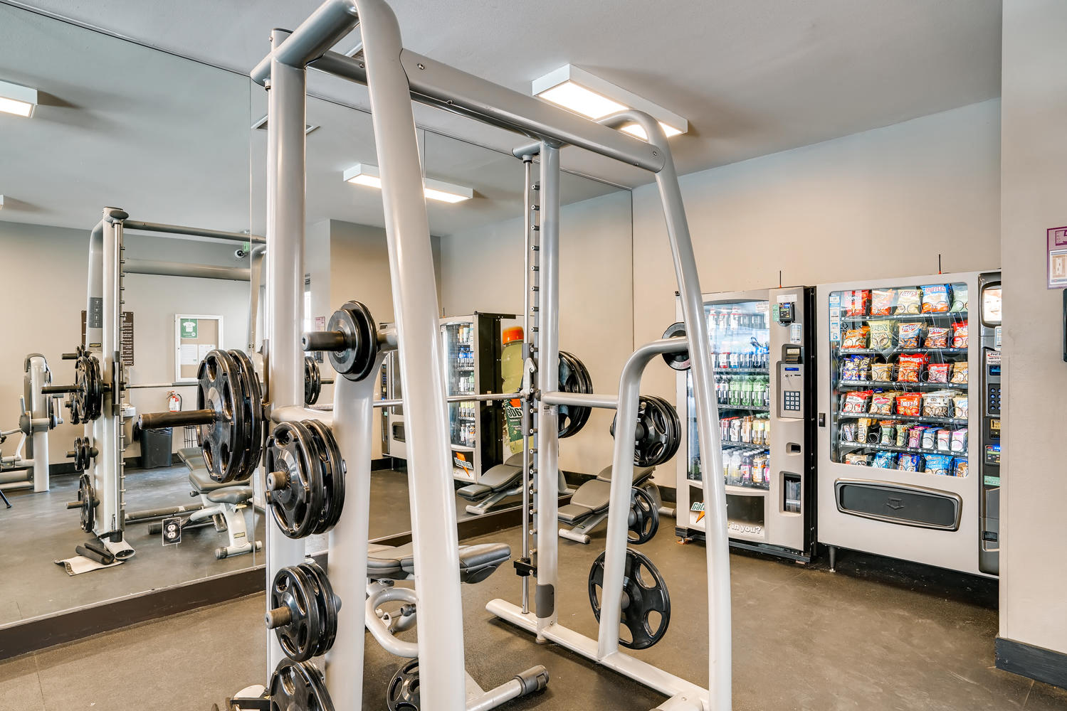 a gym with weights and vending machines