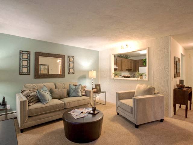 a living room with a couch and a chair