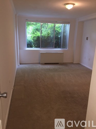 A room with a window and a door.