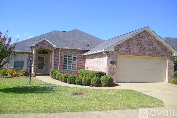 A house with a brown roof and a white garage door.