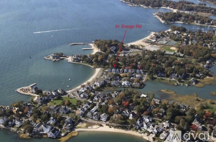An aerial view of a coastal area with a road labeled 31 Ensign Rd.
