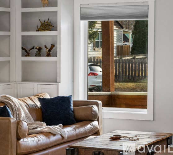 A room with a desk and a chair.