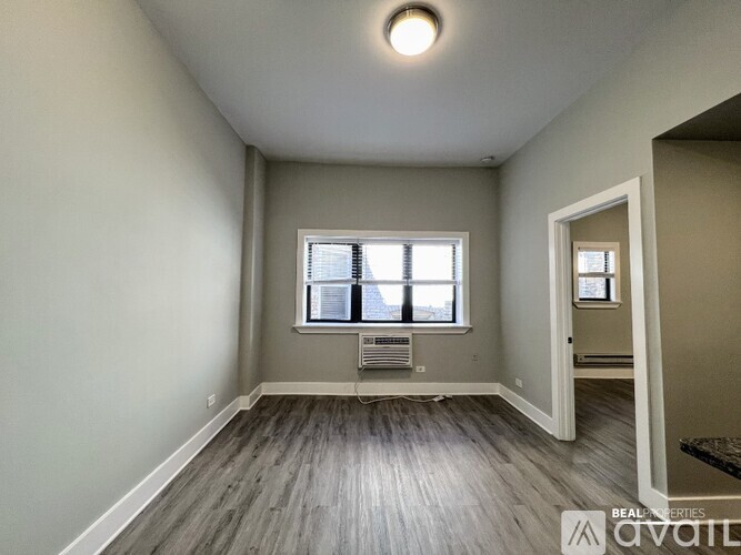 A room with a window and a door is on the market.