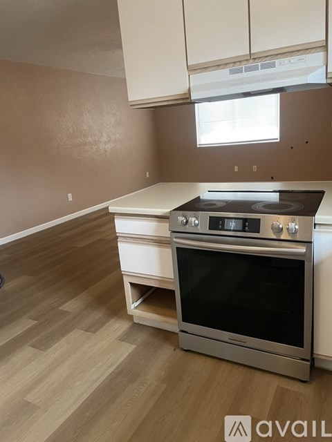 A kitchen with a stove and oven in it.