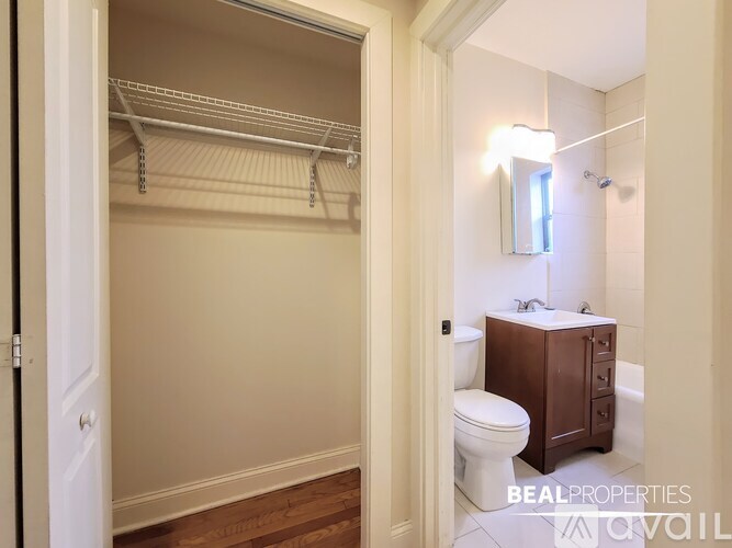 A white bathroom with a toilet and sink.