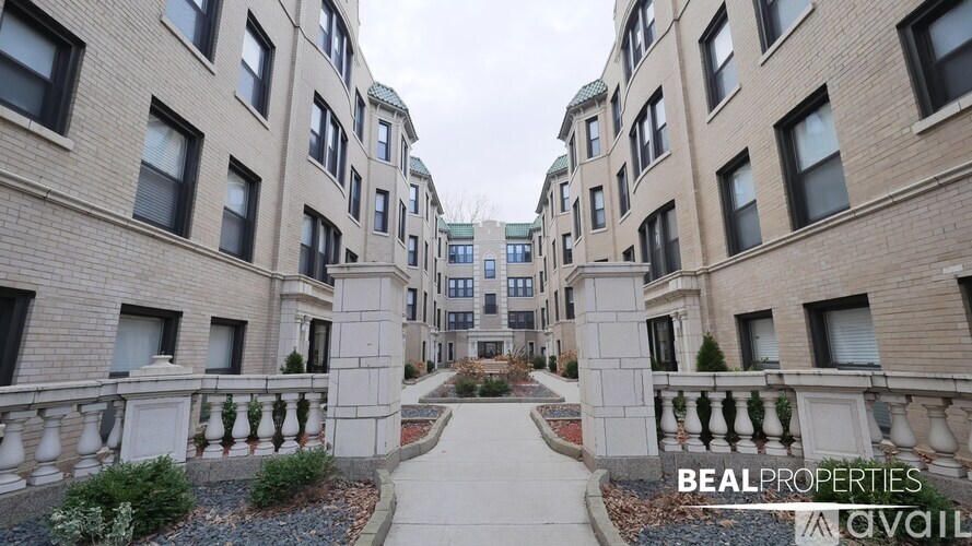 A BEALPROPERTIES sign is on a building.