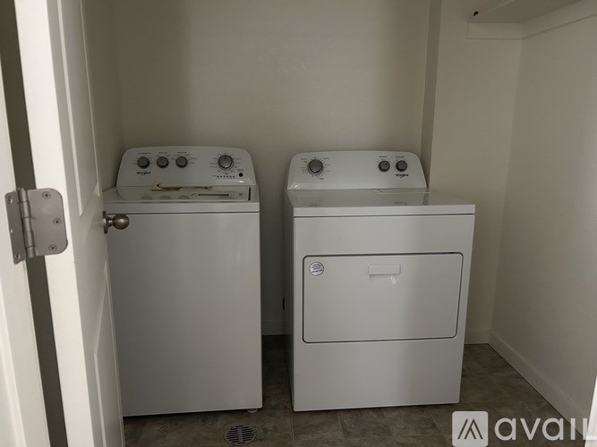 Two white ovens in a small room.