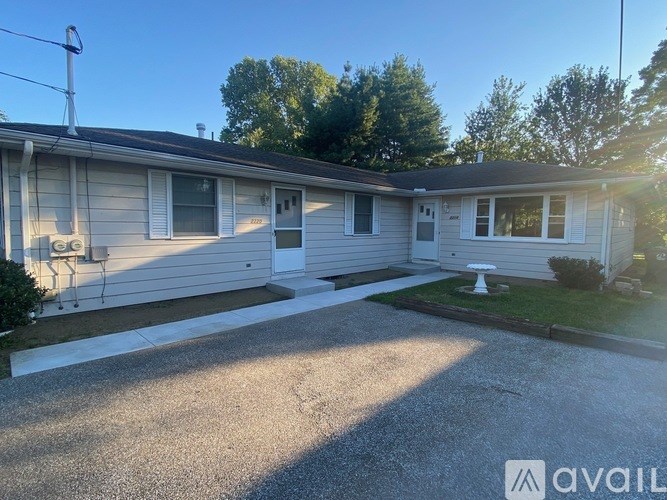 A house with a driveway in front of it.