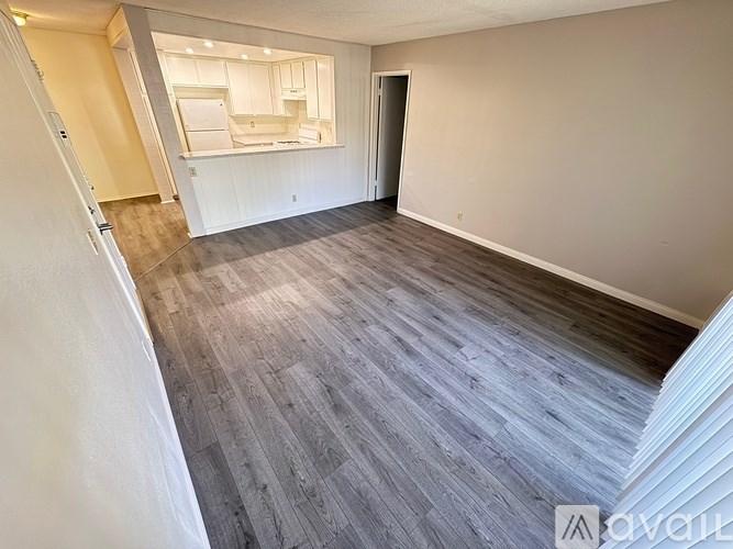 A room with a grey floor and white walls.