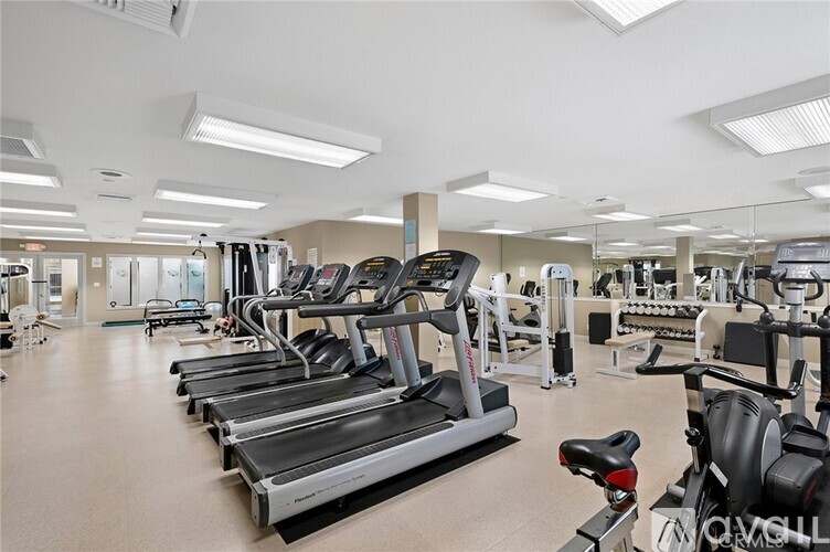 A gym with treadmills and exercise equipment.