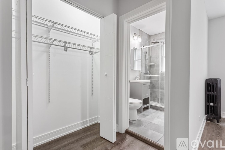 A bathroom with a walk-in shower and a toilet.